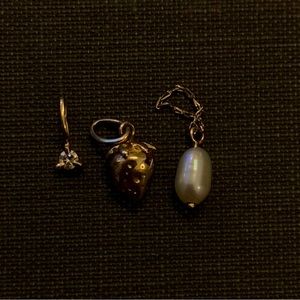 Gold charm bracelet with three charms